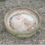 Two reconstituted stone circular troughs, each of shallow weathered form, 22cm H x 92cm D and 22cm H