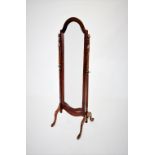 A 19th century style mahogany framed cheval mirror, late 20th century, the arched mirror raised upon