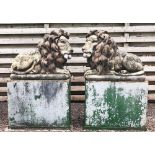A large pair of Henri Studio lion statues, each lion modelled recumbent and with coloured details,
