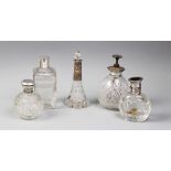 A collection of five assorted scent bottles, to include a square section example with engraved