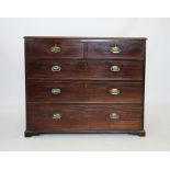 An early 19th century mahogany chest of drawers, the rectangular moulded top above two short and