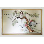 A Chinese silk embroidered picture, 20th century, depicting cranes in flight and in a fir tree, 68cm