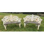 A pair of cast iron 'fern' pattern garden benches, in Coalbrookdale style, each with wooden