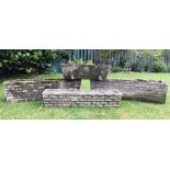 Four reconstituted stone garden planters, each of rectangular form, three with a brick moulded