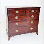 An early 19th century mahogany chest of drawers, the rectangular top with inlaid ebonised stringing,