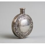 A Continental silver scent bottle, of round form with vacant cartouche and embossed floral