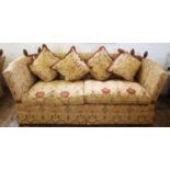 A Knole settee, late 20th century, the drop ends with rope ties, enclosing two seat cushions and a