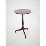 An Edwardian mahogany lamp table by Whittle and Son, Whitehaven, the circular top rim with rail