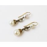 A pair of 19th century pearl and diamond drop earrings, each comprising an off-round pearl