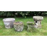 A selection of four decorative reconstituted stone garden items, to include a coopered jardiniere, a