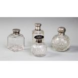Four cut glass dressing table jars, including a silver mounted example of ovoid form, with a flat