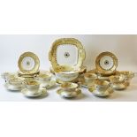 A Victorian Rockingham style tea service, 49 pieces, decorated with trailing gilt vinery on an ivory
