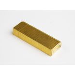 A Must de Cartier gold plated lighter, of rectangular form with engine turned decoration to