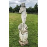 A reconstituted stone figure of Venus, modelled standing upon a shell, 115cm H, upon a square plinth