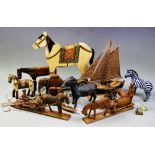 A collection of vintage models, mid 20th century and later, to include a painted pull-along horse,