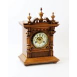 An early 20th century German oak cased bracket clock, by the Hamburg American Clock Co. the golden