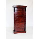 A mid 19th century mahogany Wellington chest, the rectangular top above seven graduated and cock