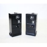 Two vintage telephone coin box installations, the black metal rectangular boxes with 1p,2p and 5p