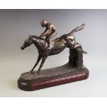 A 20th century contemporary resin sculpture by Robert Donaldson, modelled as a horse and jockey