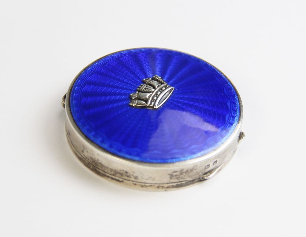 A silver and enamel compact, Turner & Simpson, Birmingham 1931, of circular form, the hinged lid