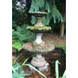 A reconstituted stone three tier water fountain, each tier reducing in size and raised on a