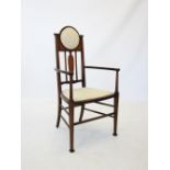 An early 20th century, Glasgow School Arts and Crafts mahogany and inlaid elbow chair, stamped