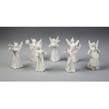 A seven piece Dresden porcelain angel orchestra, mid 20th century, the white glazed figures modelled