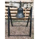 A large cast iron bell, dated 1996, black painted upon free-standing metal A-frame support, bell