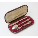 A cased Victorian silver three piece christening set, Brown & Clark, Birmingham 1851, comprising a