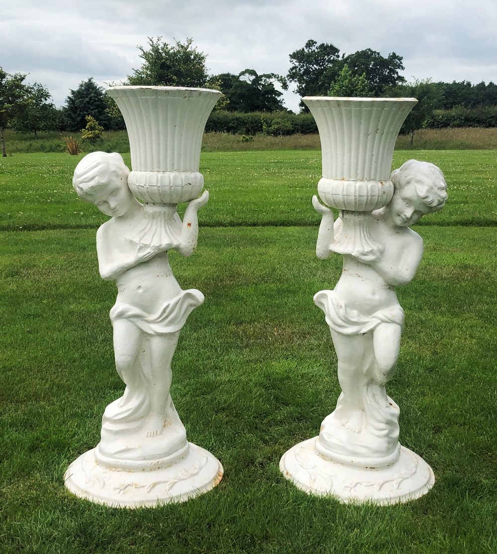 A pair of cast iron figural jardinieres, white painted, each modelled as a scantily clad putti - Bild 2 aus 11