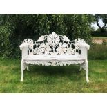 A Coalbrookdale style bench, oak leaf pattern, the white painted cast iron bench with wooden slatted