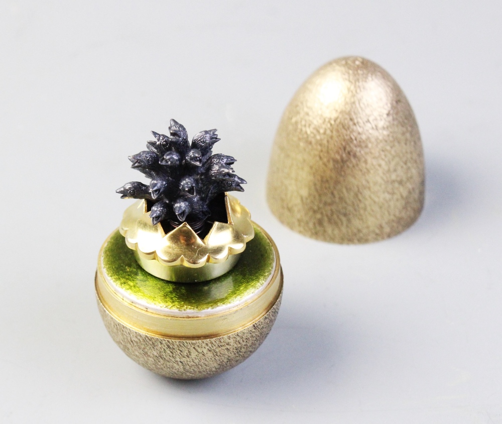 A Stuart Devlin 'Sing a Song of Sixpence' silver gilt egg, London 1982, the exterior with textured - Image 2 of 3