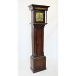 A mid 18th century oak cased thirty hour long case clock, the flat top with a moulded cornice