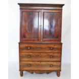 A William IV mahogany linen press, with a cavetto cornice above a plain frieze applied with beaded