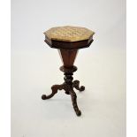 A Victorian walnut sewing table, the octagonal top with chequered and foliate inlay, enclosing a