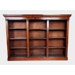 A mid 19th century mahogany open bookcase, the rectangular top with a small break front above an