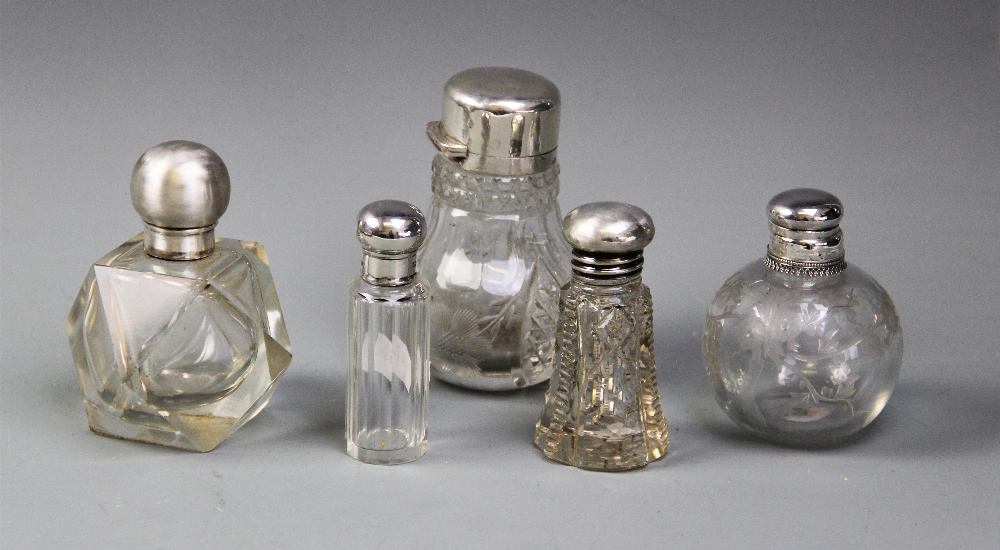 Five assorted glass dressing table jars, including a Victorian baluster form, silver mounted