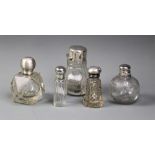 Five assorted glass dressing table jars, including a Victorian baluster form, silver mounted