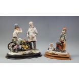 A Capo di Monte porcelain figural scene, modelled as a market trader selling vegetables from a
