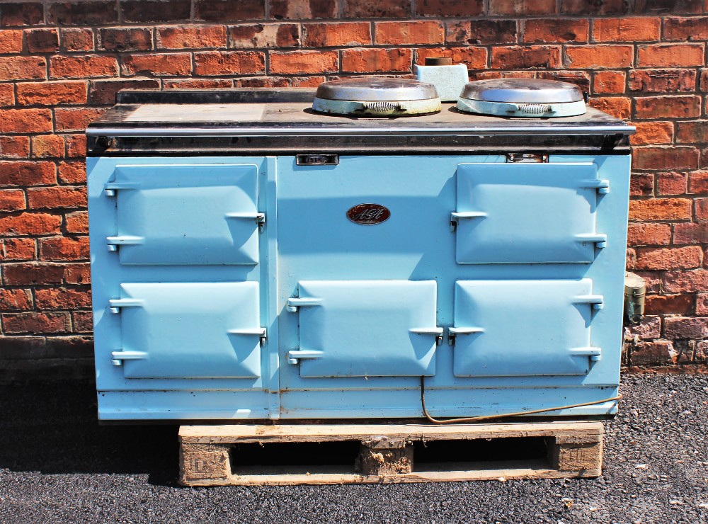 A mid 20th century pale blue Aga, the black top with two chromed hinged hob covers above a chromed