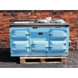 A mid 20th century pale blue Aga, the black top with two chromed hinged hob covers above a chromed