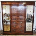 A late 19th century rosewood compactum wardrobe, the moulded cornice above a frieze inlaid with