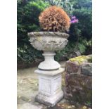 A pair of reconstituted stone garden urns, each of bowl form and cast with anthemion and acanthus