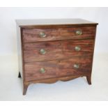 An early 19th century mahogany chest of drawers, the rectangular top with a reeded edge above