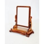 A Victorian mahogany dressing table mirror, of rectangular form on curvilinear supports and a