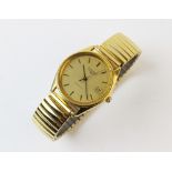 A gent's Longines automatic gold plated wristwatch, the round gold toned dial with baton markers and