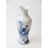 A Chinese blue and white begonia vase, 19th century, the vase of typical baluster form in the Kangxi