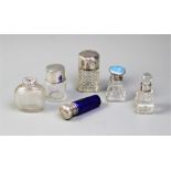 Six glass scent bottles, including a Victorian silver mounted example, of tapering form with blue