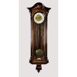 A Victorian Vienna walnut cased three weight regulator wall clock, the arched case with ebonised