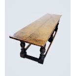 A 17th century and later oak refectory table, the rectangular twin plank cleated top above a lunette